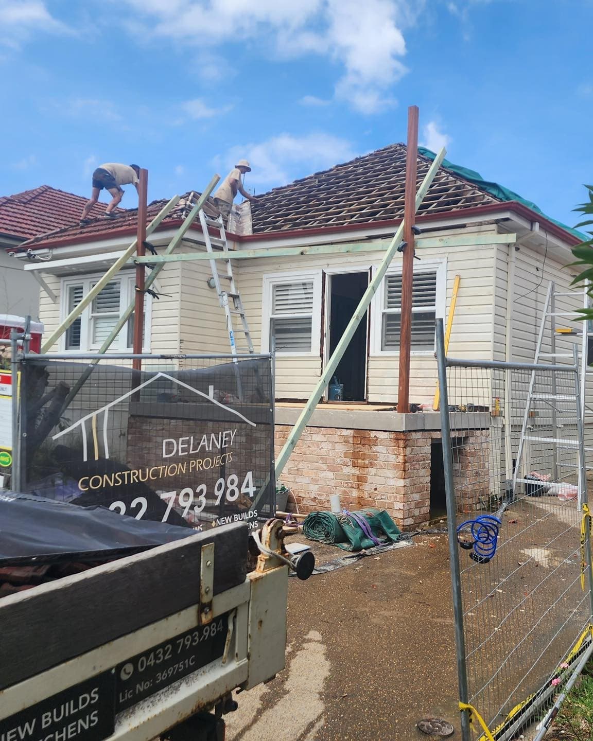 During — scaffold up and the site sign on the fence