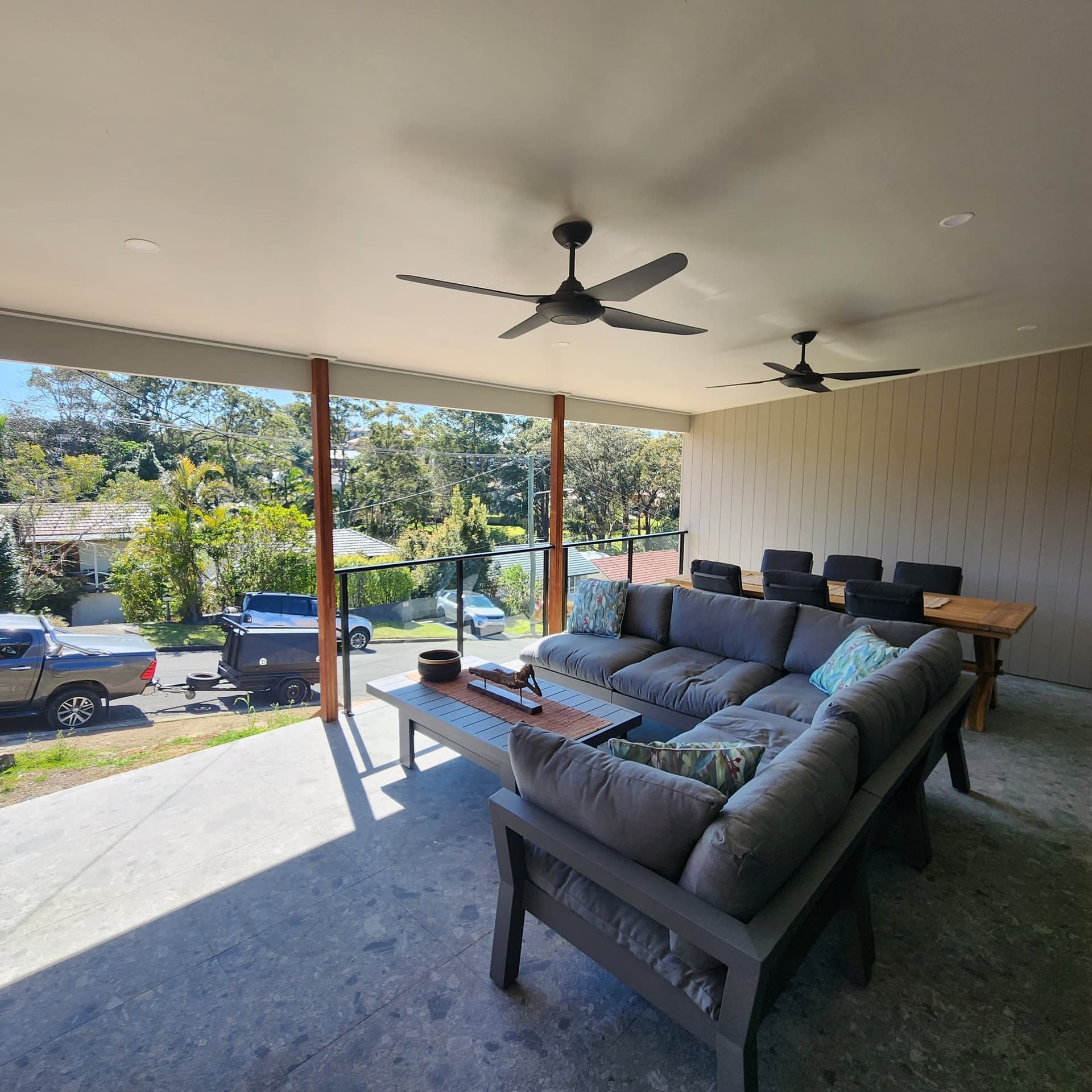 The covered alfresco with slat screening and ceiling fans