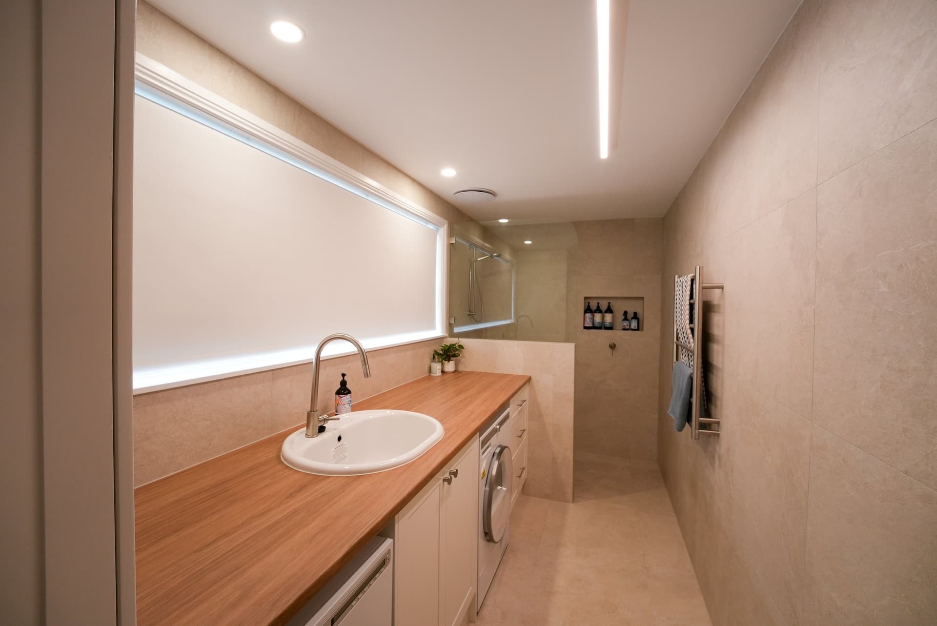 Laundry with a timber bench and strip light