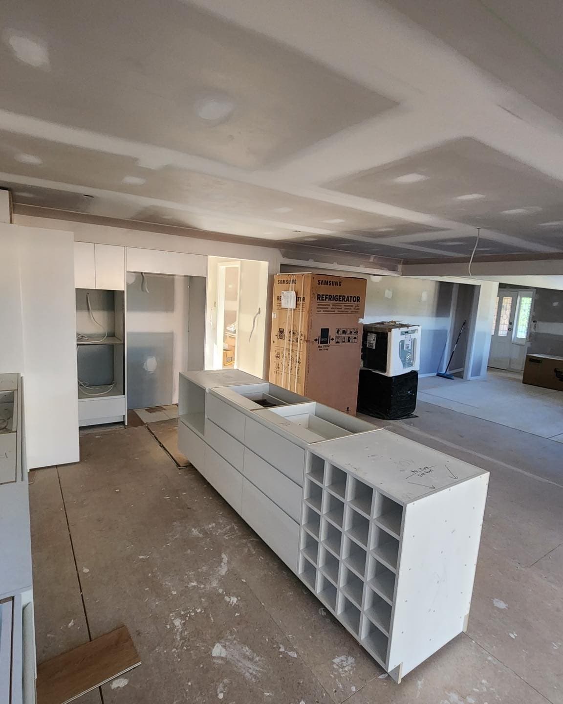 Mid-build — the island with its built-in wine rack going in