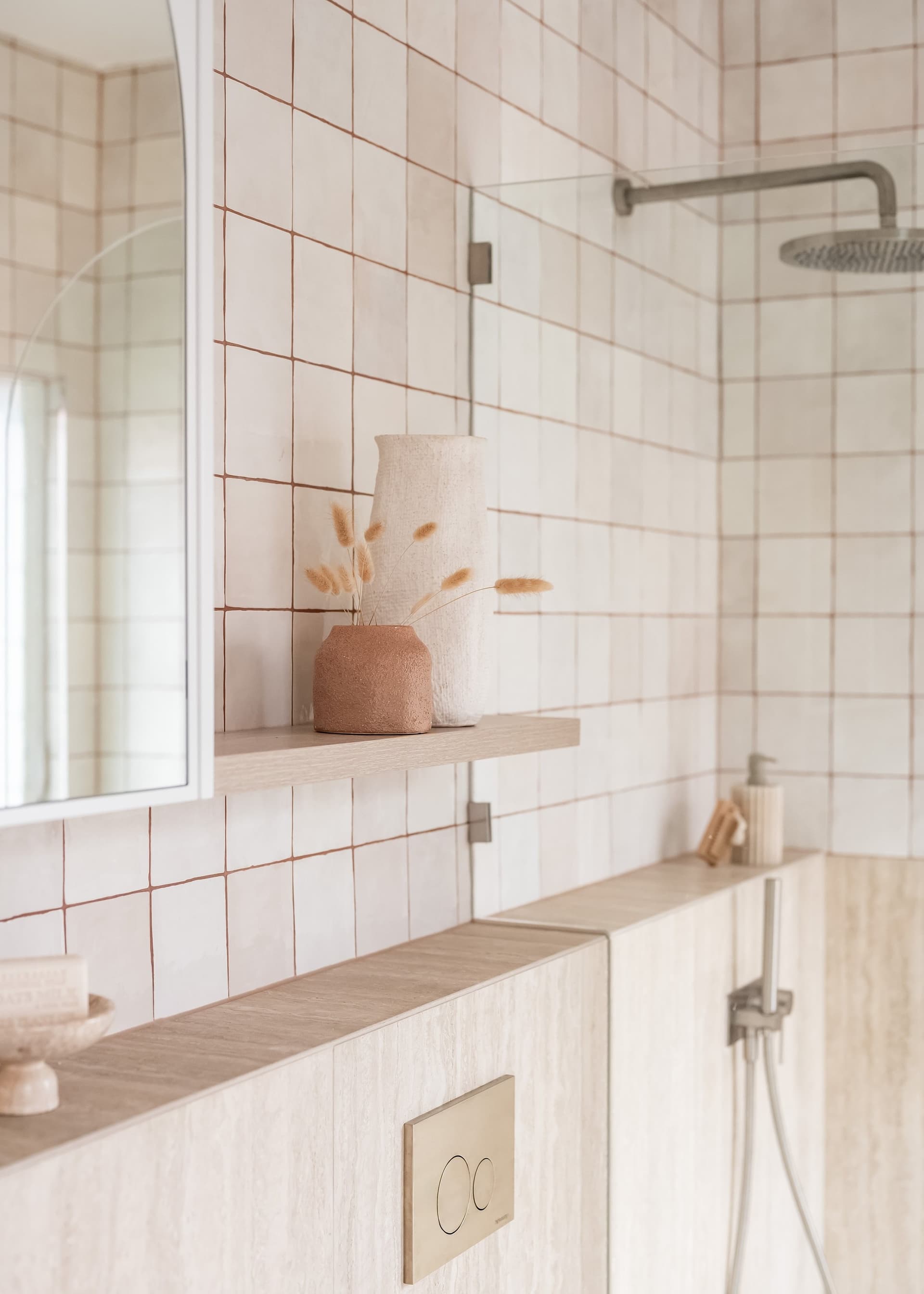 Walk-in shower in warm square tile