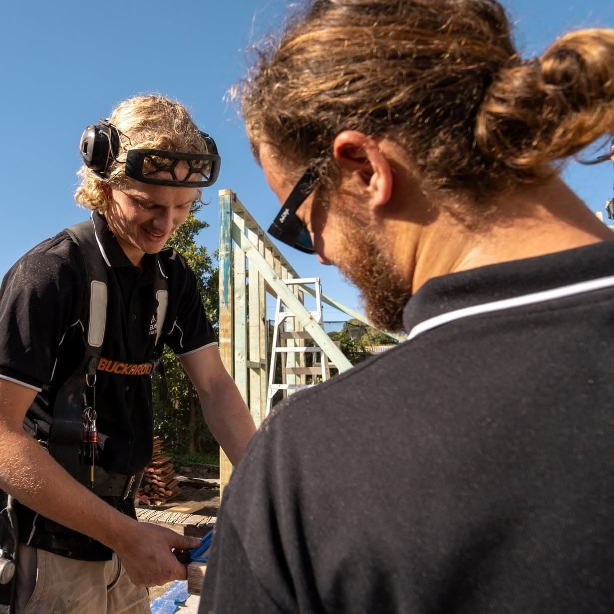 The crew going over the plans on site